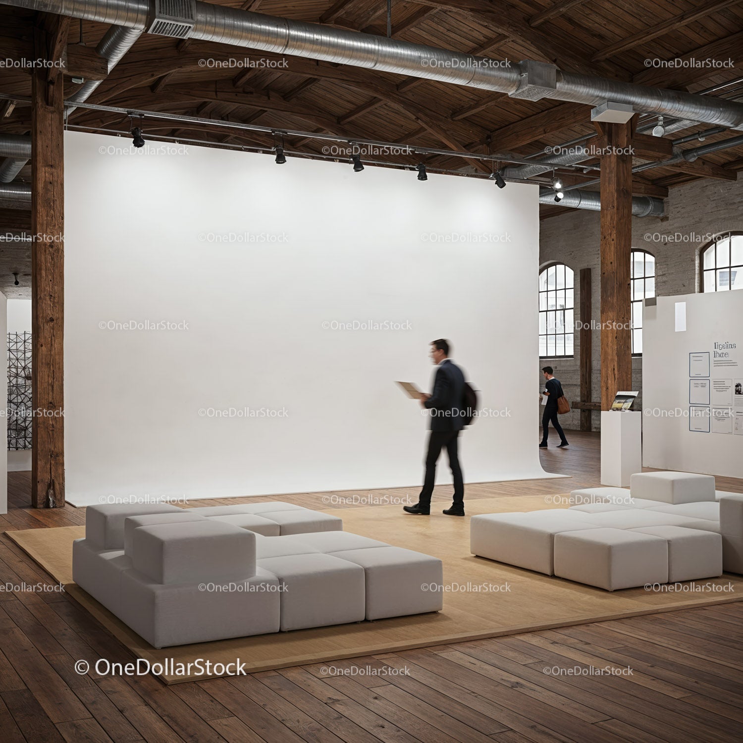 Modern art gallery with minimalist seating and visitors