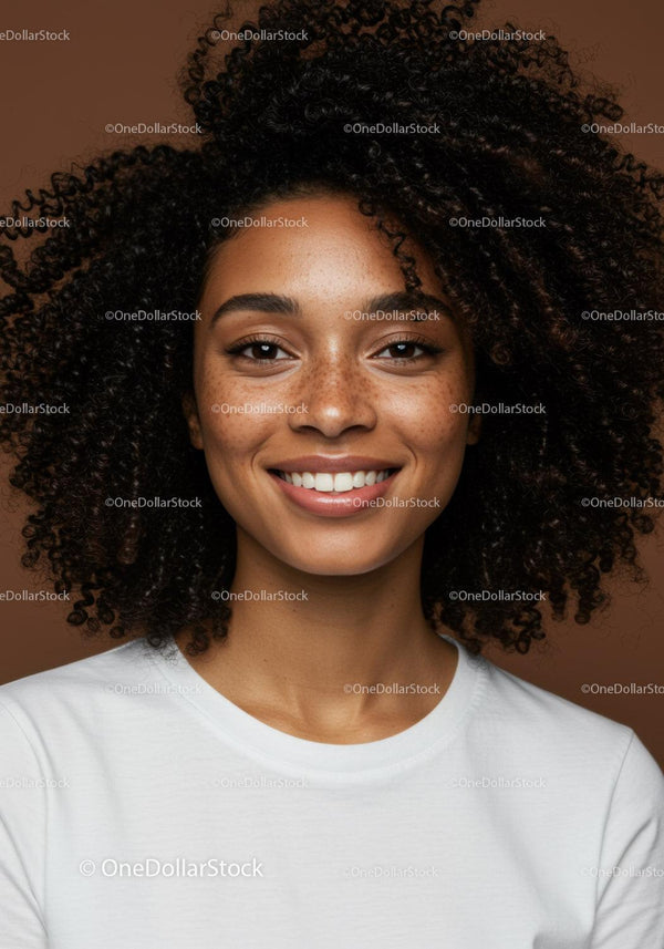Portrait of Smiling Woman with Curly Hair in Casual Attire