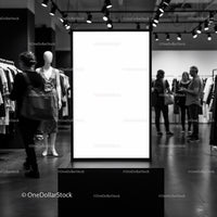 Blank vertical advertising board in modern fashion store