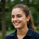 Joyful Young Woman Smiling Outdoors in Natural Light