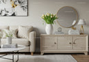 Elegant Living Room Decor with White Tulips and Wooden Sideboard