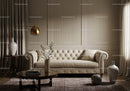 Cozy beige living room with tufted sofa and warm lighting
