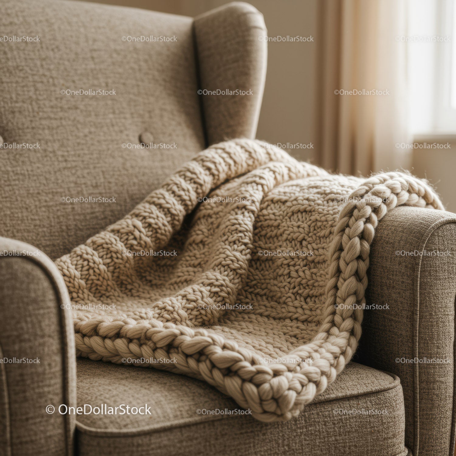 Cozy armchair with chunky knit beige blanket