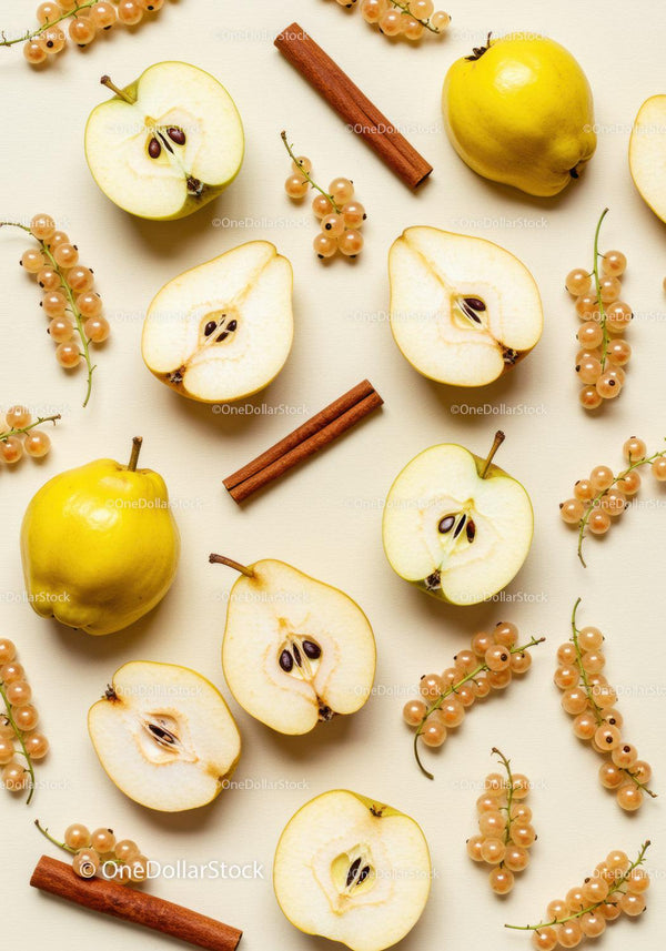 Quince fruit halves with white currants and cinnamon sticks