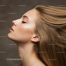 Profile of young woman with flowing blonde hair