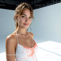 Young Woman Smiling Outdoors in Summer Dress with Jewelry