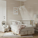Elegant Nursery with White Baby Crib and Cozy Decor