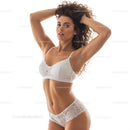 Elegant Woman in White Lace Lingerie with Confident Pose