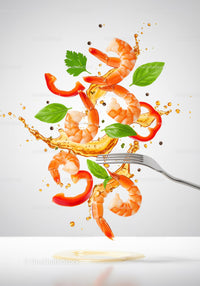 Fresh shrimp and herbs with splash of sauce in motion