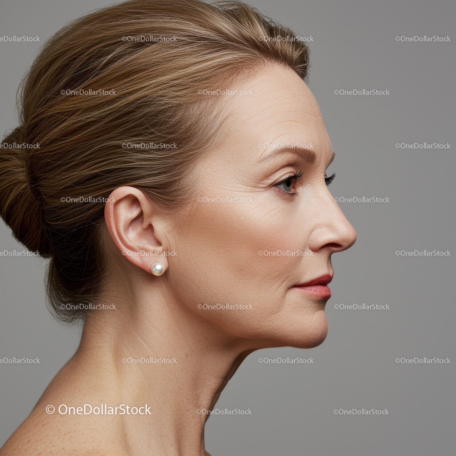 Elegant Mature Woman Profile with Stylish Hair and Pearl Earring