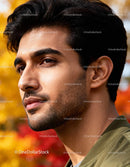 Thoughtful young man in autumn outdoor setting