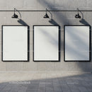 Three Blank Posters on Urban Stone Wall with Lamps