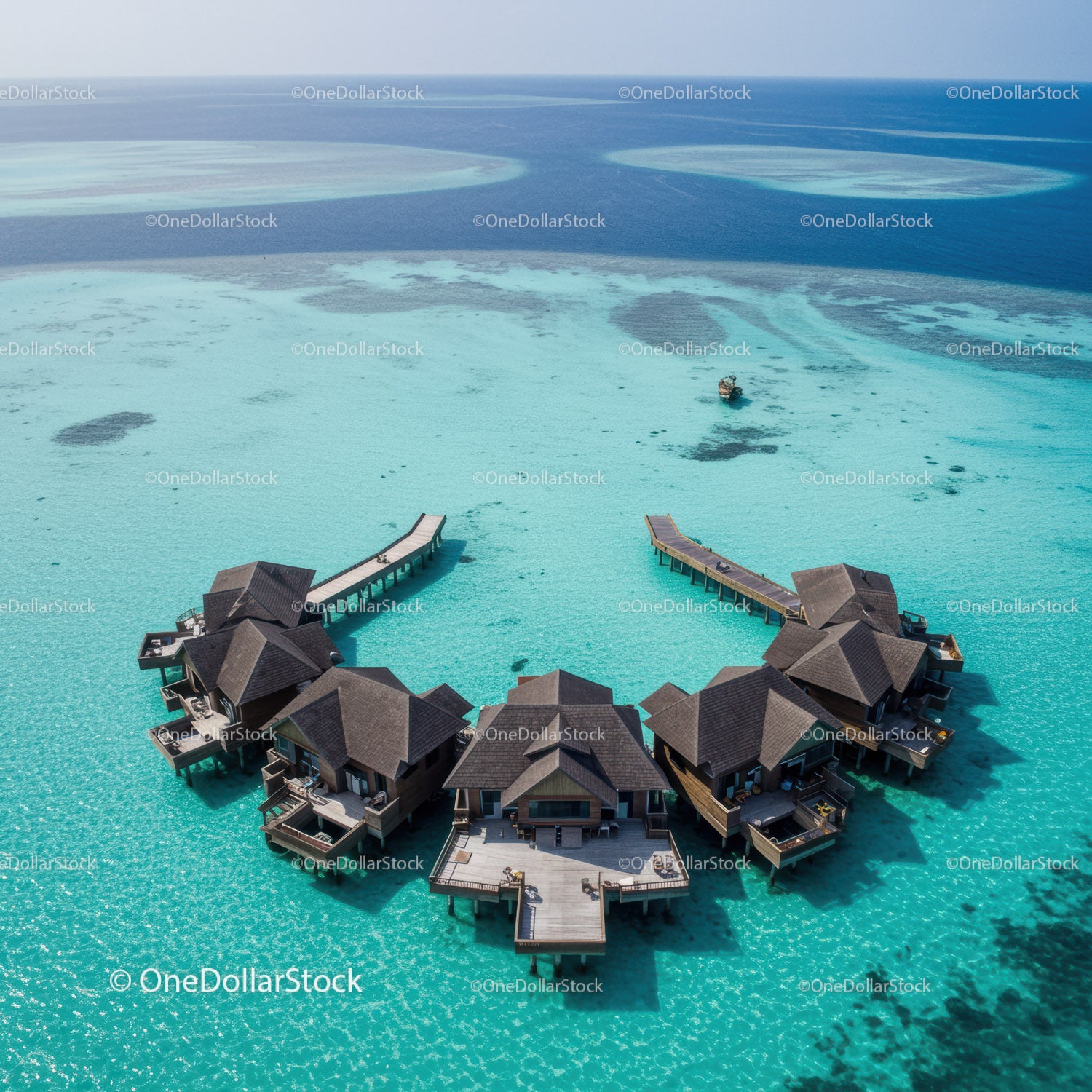 Luxury Overwater Bungalows in Turquoise Lagoon with Scenic Ocean View