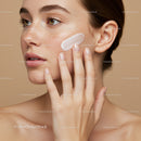 Close-up of Woman Applying Face Cream for Skincare Routine with Flawless Skin