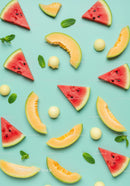 Fresh watermelon and cantaloupe slices with mint leaves