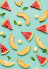 Fresh watermelon and cantaloupe slices with mint leaves