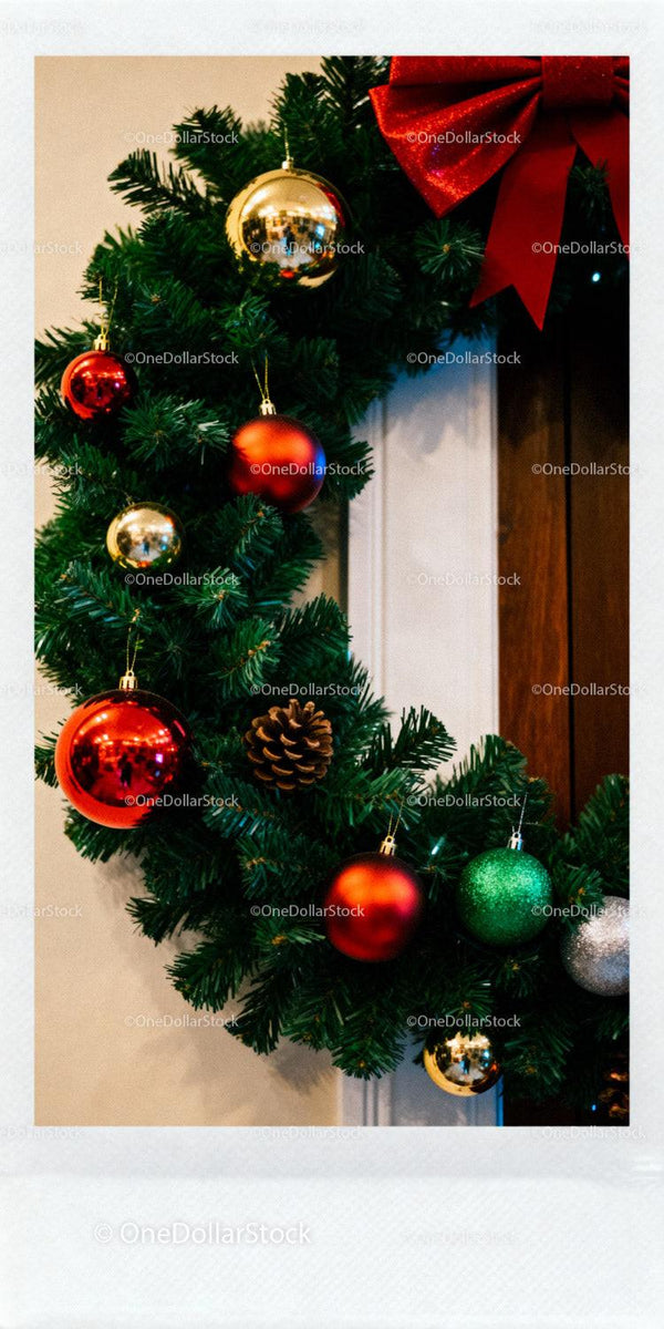 Festive Christmas wreath with colorful ornaments and pinecone