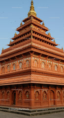 Red and Gold Tiered Buddhist Temple with Ornate Decorations