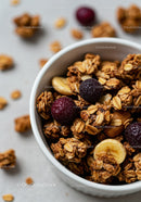 Close up of granola with dried berries and banana slices