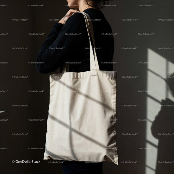 Woman holding blank eco friendly tote bag indoors JPG Mockup Image