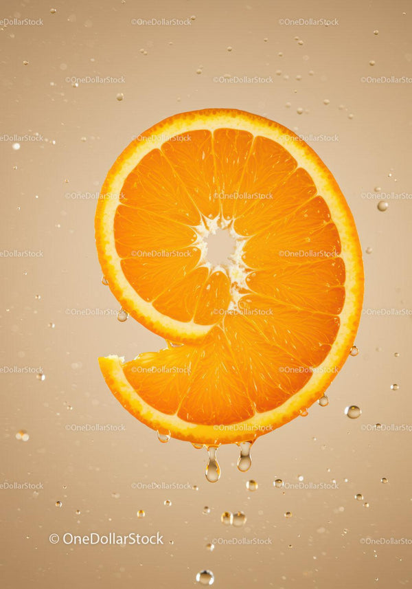 Fresh orange slice with water droplets close up