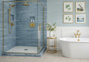 Modern bathroom with blue tile shower and freestanding tub