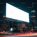 Bright Blank Billboard Overlooking Vibrant Cityscape At Night