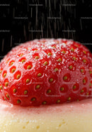 Close up of strawberry with sugar falling on dessert