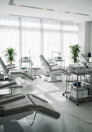 Modern Medical Clinic with Examination Chairs and Healthcare Equipment