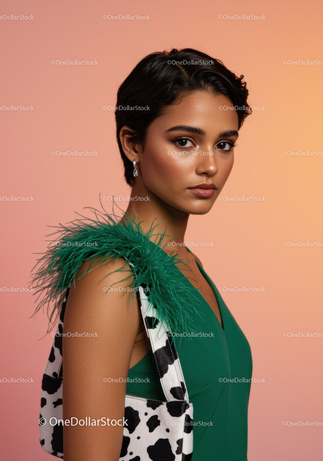 Fashion Portrait of a Woman with Short Hair Wearing a Green Dress and Feather Detail