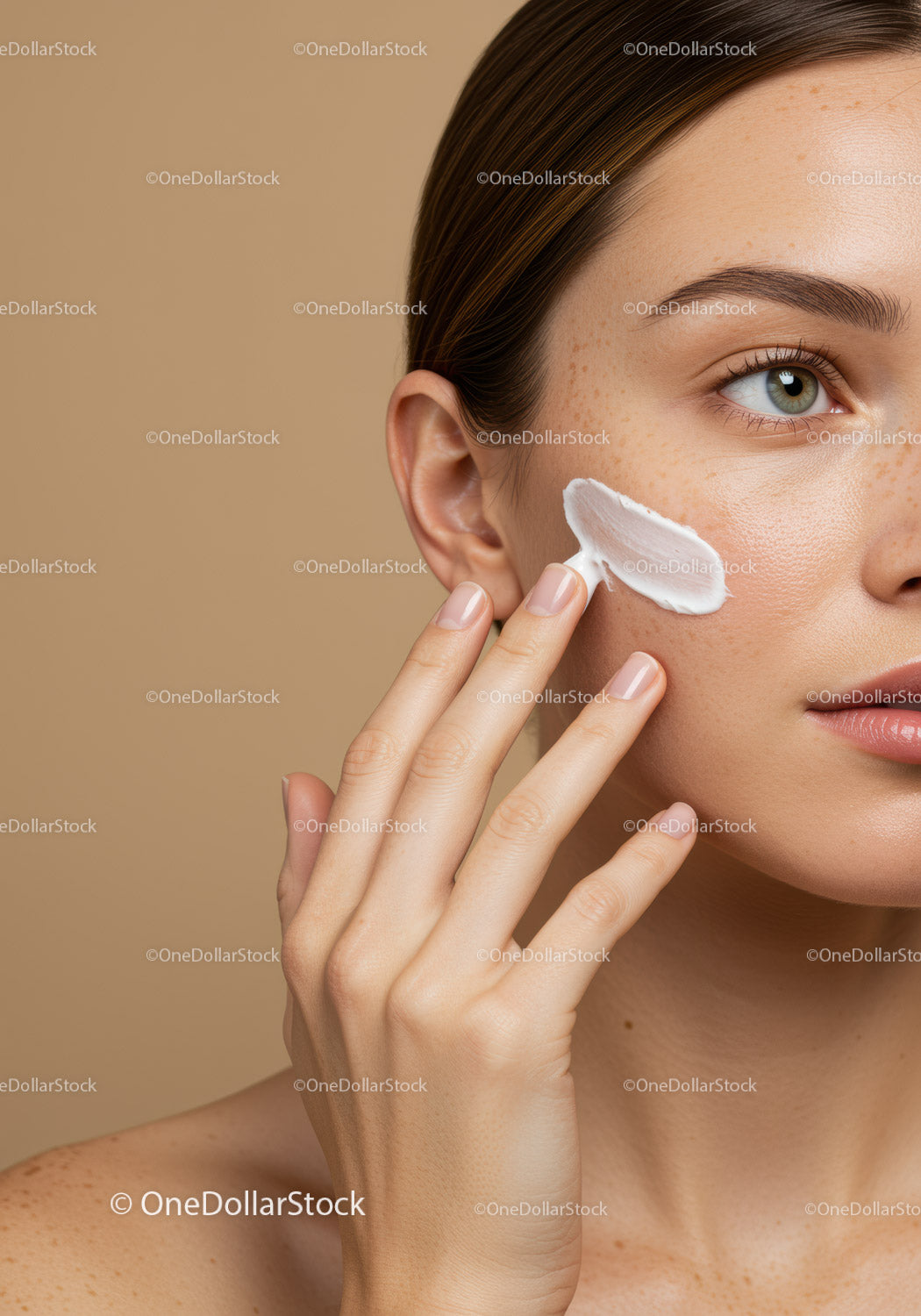 Close-Up of Woman Applying Facial Moisturizer for Healthy Skin