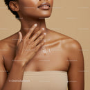Elegant Woman with Glowing Skin Touching Her Neck in Minimalist Setting