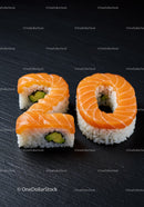 Salmon sushi rolls shaped as number twenty on slate
