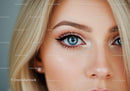 Close-up of blue eye with natural makeup on blonde face