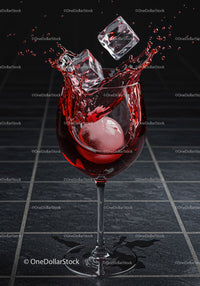 Wine Glass with Splash and Ice Cubes in Motion