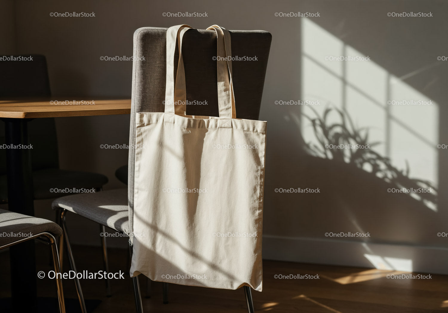 Natural light casting shadows on beige tote bag indoors