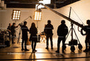 Professional film crew recording an interview setup