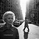 Elderly Woman in Busy City Street Surrounded by Vintage Cars
