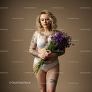 Tattooed Woman in White Lingerie Holding Purple Flower Bouquet