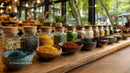 Colorful Spice Jars and bowls on Wooden Kitchen Countertop