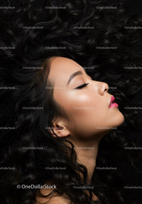 Profile of serene woman with voluminous curly hair