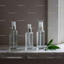 Minimalist skincare spray bottles on marble surface JPG Mockup Image preview