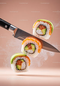 Fresh sushi rolls slicing on sharp kitchen knife