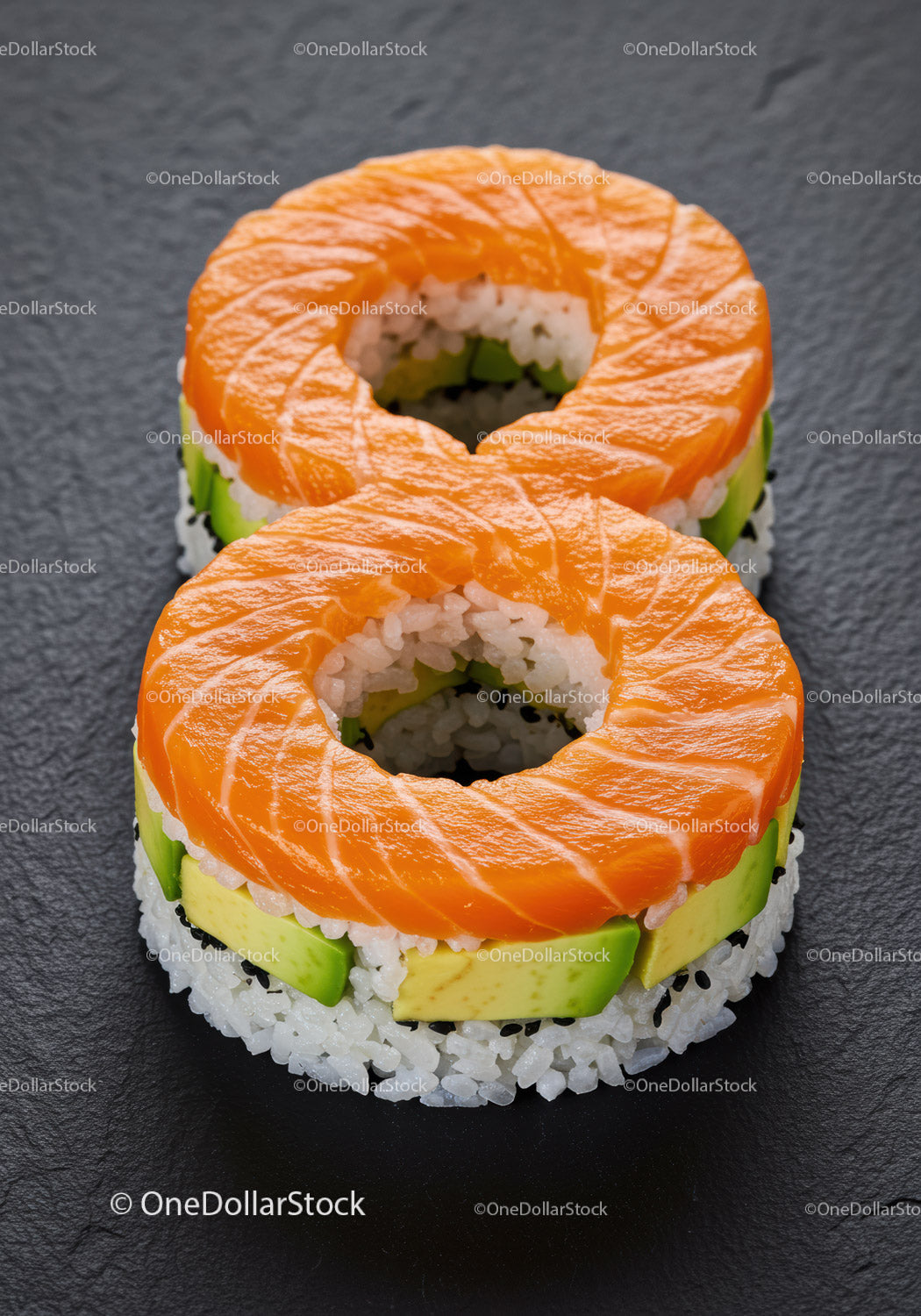 Ring-shaped sushi with salmon and avocado slices