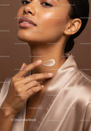 Close-Up of a Woman Applying Moisturizer for Radiant Skin