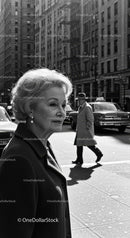 Elegant Elderly Woman Walking in City Street with Classic Fashion