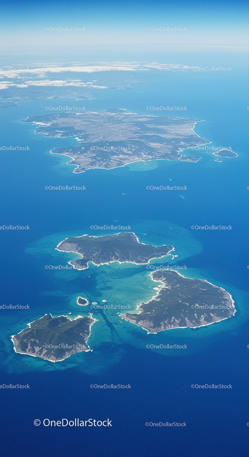 Aerial View of Tropical Islands Surrounded by Clear Blue Ocean