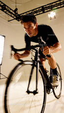 Focused Male Cyclist Training on Indoor Bike Trainer