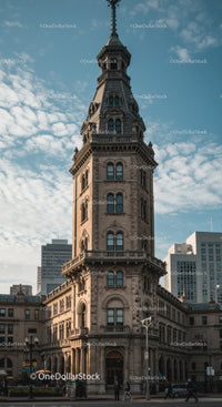 Historic Stone Tower in Urban City Skyline with Modern Skyscrapers
