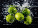 Fresh Green Apples Splashing into Water with Vibrant Splash
